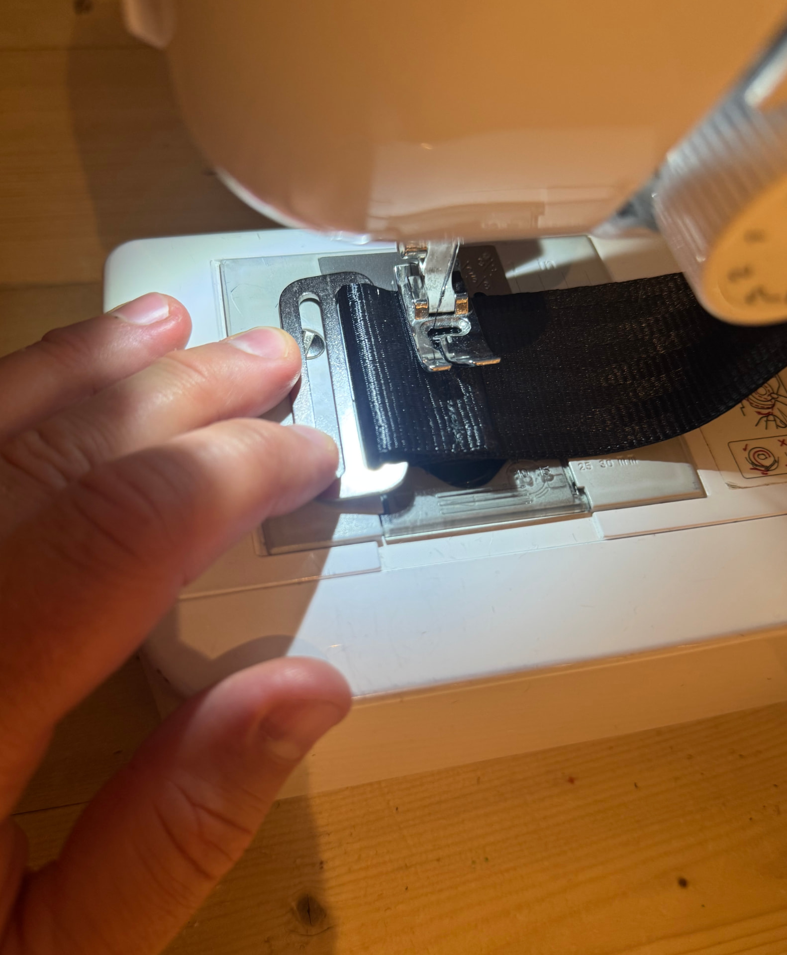 Close-up of the stitching and metal buckle on a Fat Free Golf training band